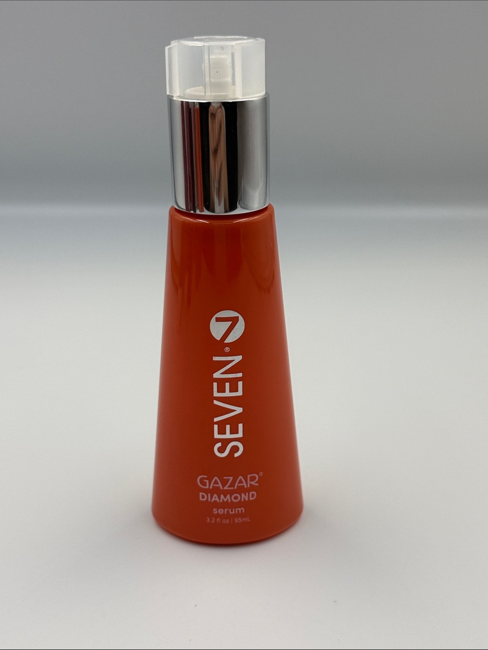 Seven7 Orange Serum Bottle with Silver Pump